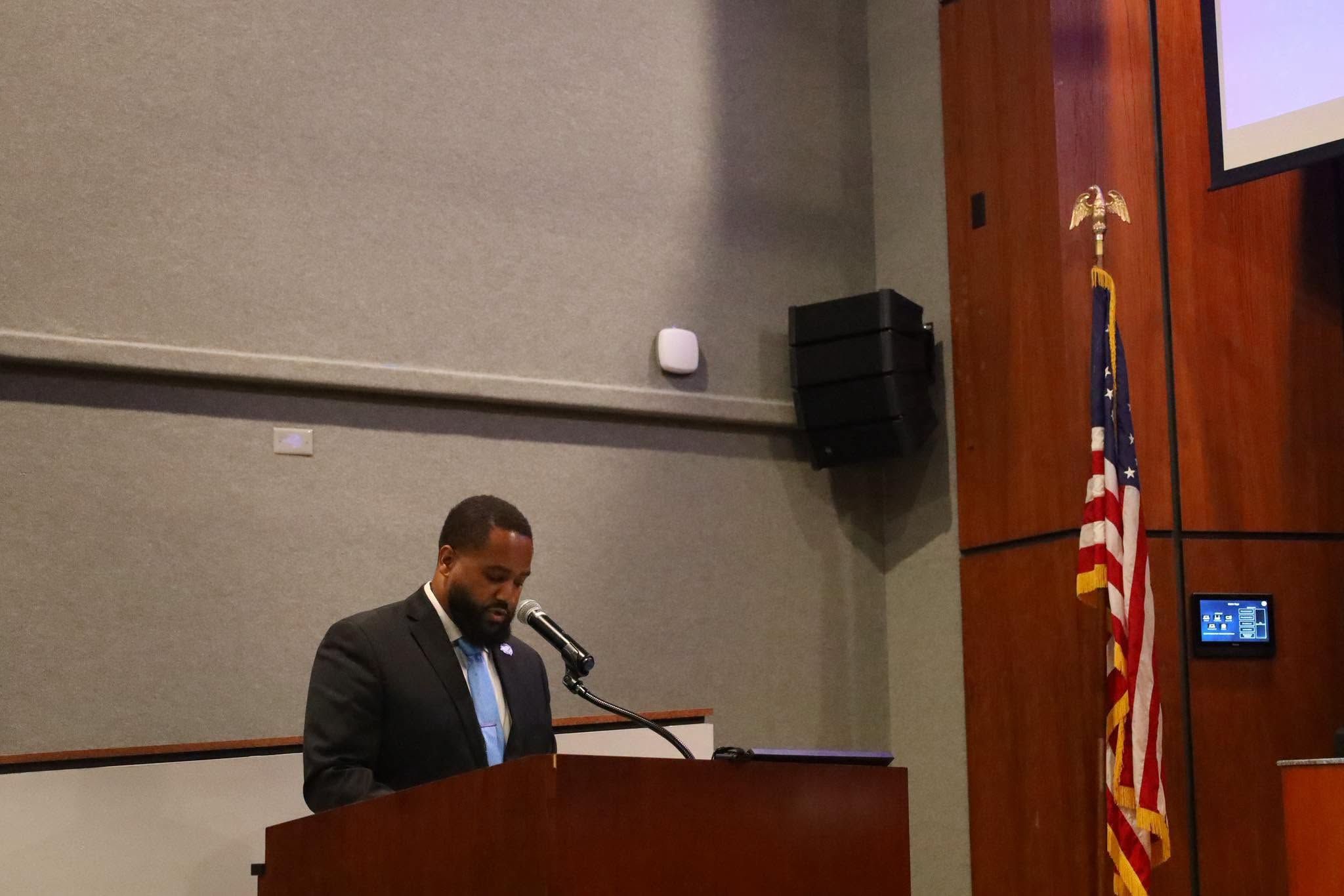 Dr. Fields speaking at a podium